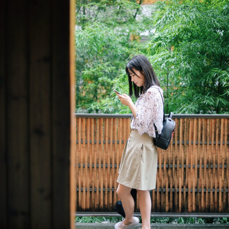 A person reading information from her smartphone