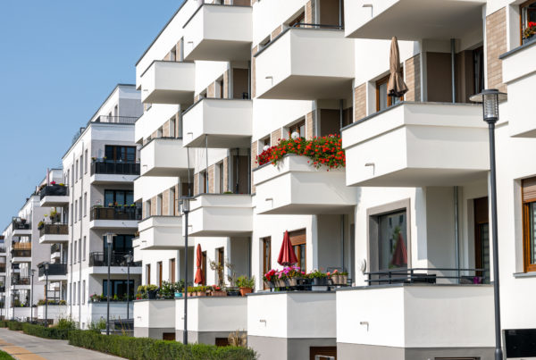 Modern apartment buildings with many balconies seen in Berlin Top 5 Best Channel Managers for Vacation Rentals