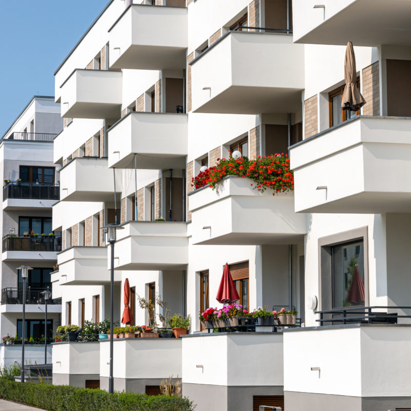 Modern apartment buildings with many balconies seen in Berlin Top 5 Best Channel Managers for Vacation Rentals